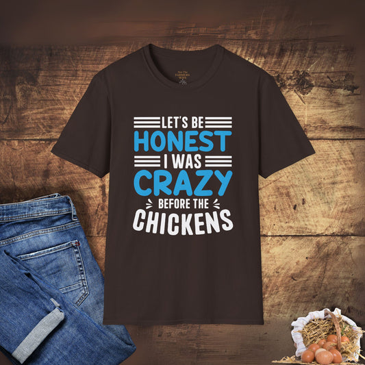 Brown t-shirt with humorous text design on a wooden background with jeans and chickens.